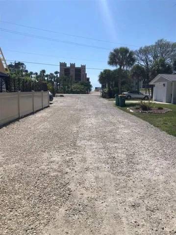 a view of a balcony next to a yard