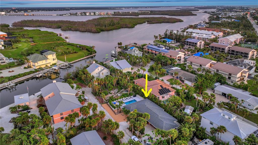 2795 North Beach Road, Unit A Englewood, FL 34223 - Photo 52 of 53 an aerial view of lake and residential houses with outdoor space