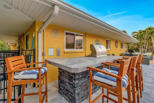 a table and chairs in front of a house