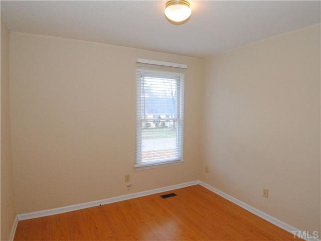 3629 Castlegate Drive Raleigh, NC 27616 - Photo 4 of 9 a view of an empty room with a window