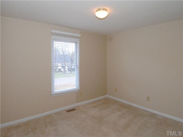 3629 Castlegate Drive Raleigh, NC 27616 - Photo 5 of 9 an empty room with a window