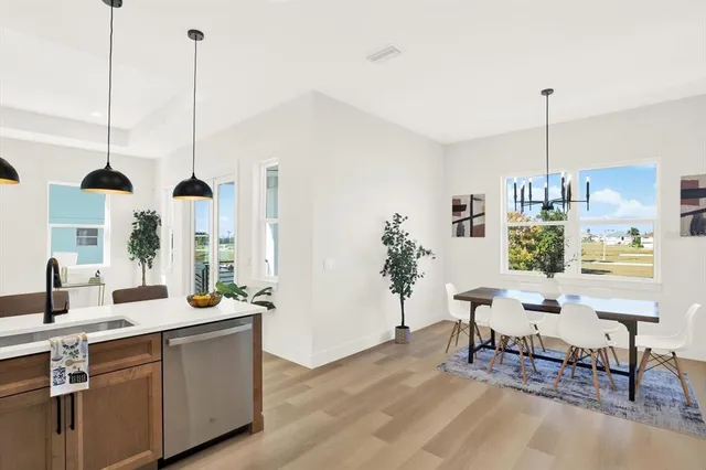 a very nice looking room with a large window and furniture