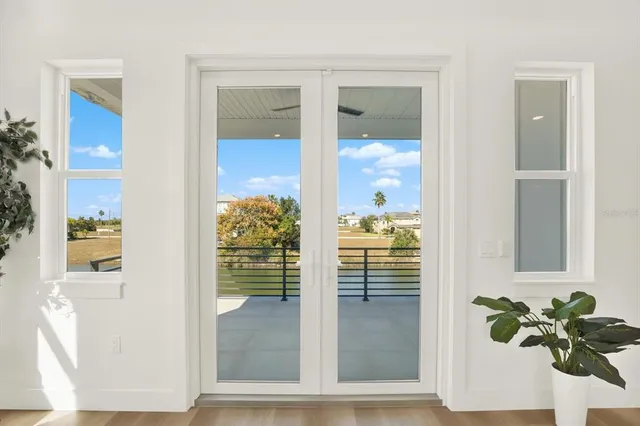 a view of a glass door with a glass door and chair