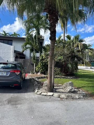 a view of street with a car parked