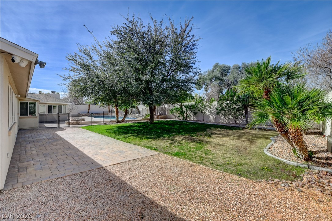 4207 Ridgecrest Drive Las Vegas, NV 89121 - Photo 23 of 27 Fenced backyard with Lemon, Keylime, Orange, Mandarin, Grapefruit and Fig Trees! And a fire pit by the pool!