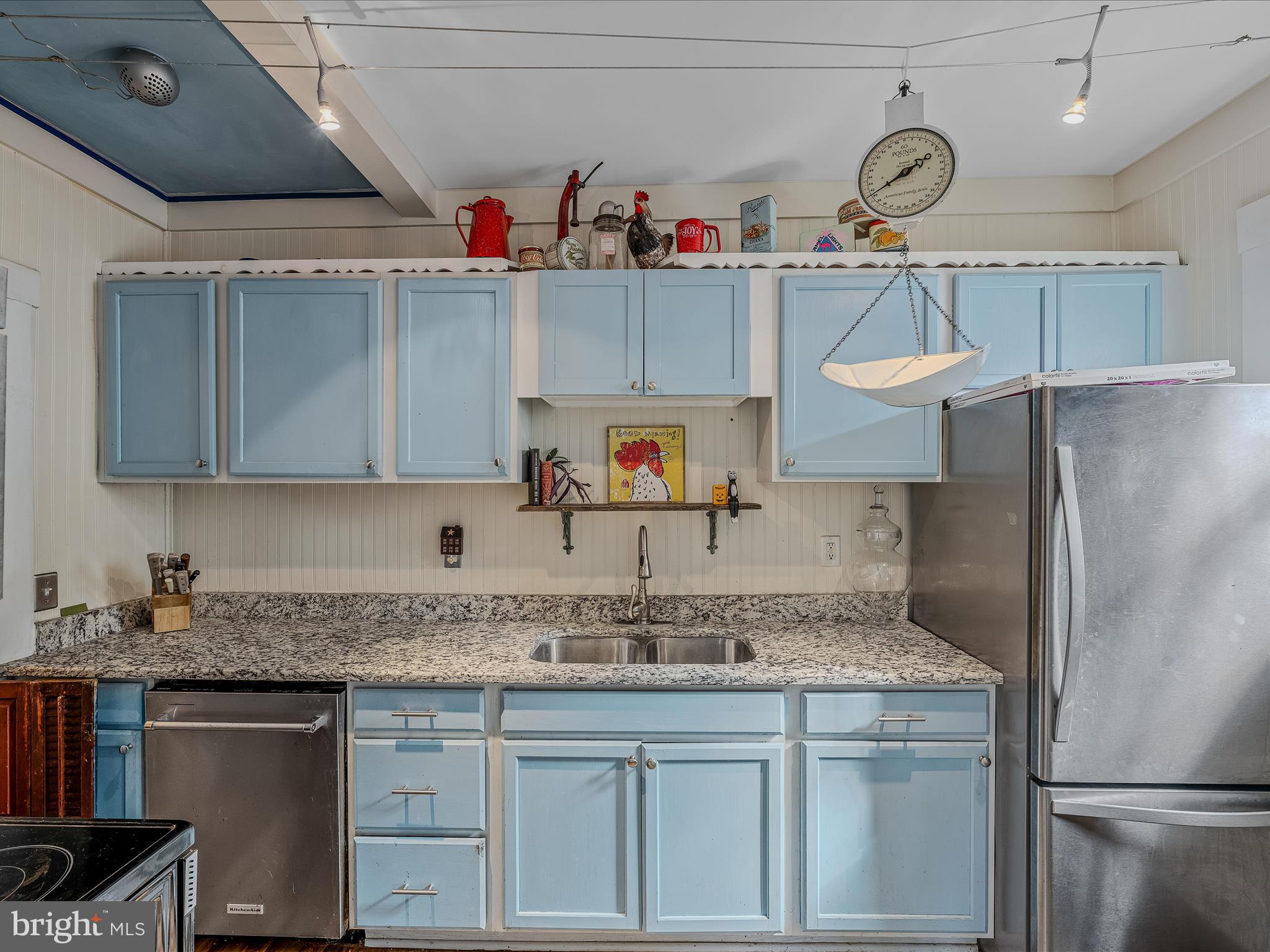 9872 Winchester Avenue Bunker Hill, WV 25413 - Photo 14 of 46 a kitchen with stainless steel appliances granite countertop a sink and cabinets