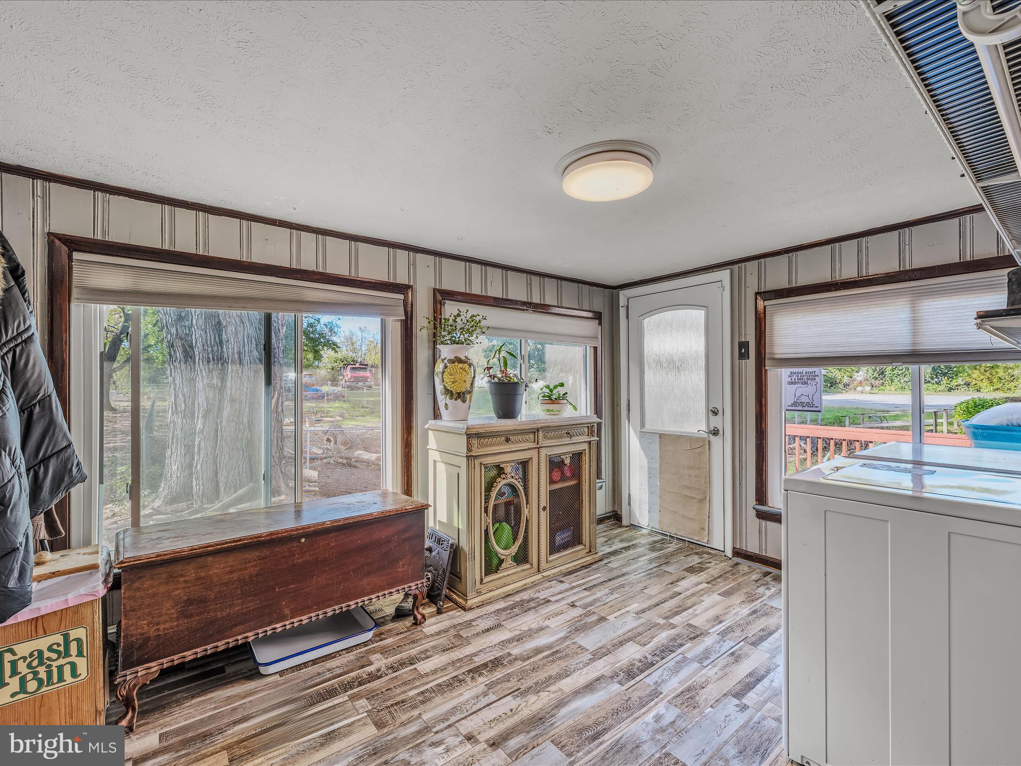 9872 Winchester Avenue Bunker Hill, WV 25413 - Photo 15 of 46 a spacious bedroom with a large window and a fireplace