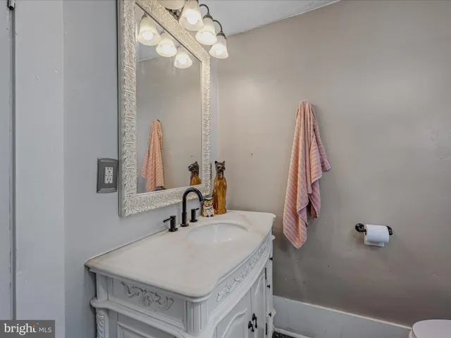 a bathroom with a sink a mirror and a bathtub