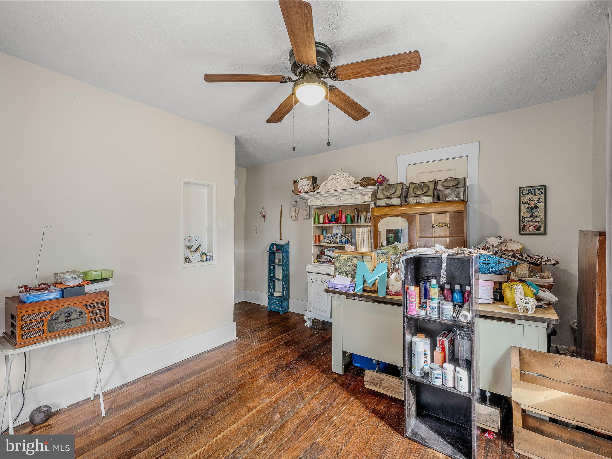 9872 Winchester Avenue Bunker Hill, WV 25413 - Photo 25 of 46 a living room with furniture and a book shelf