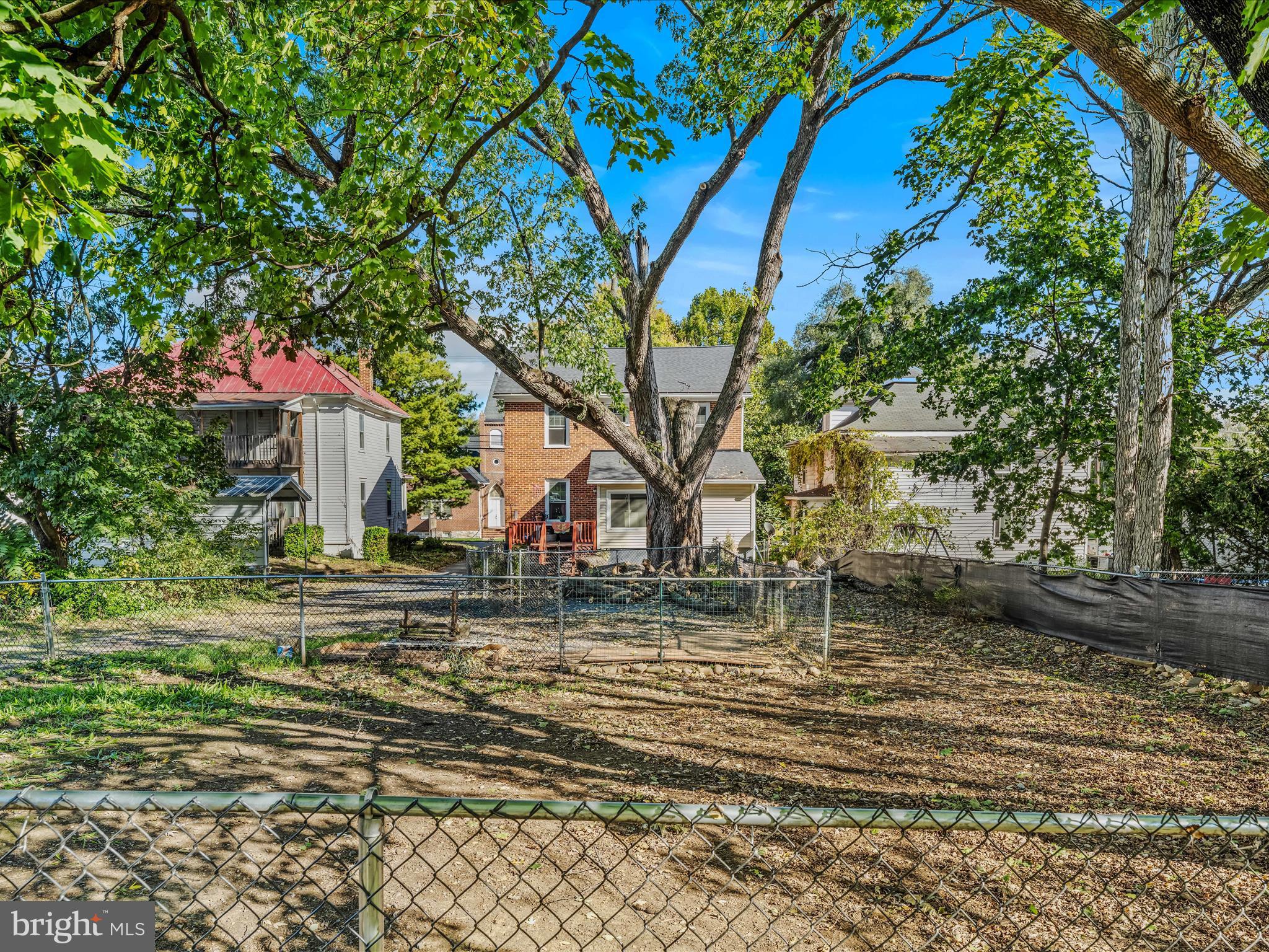 9872 Winchester Avenue Bunker Hill, WV 25413 - Photo 35 of 46 a backyard of a house with lots of green space
