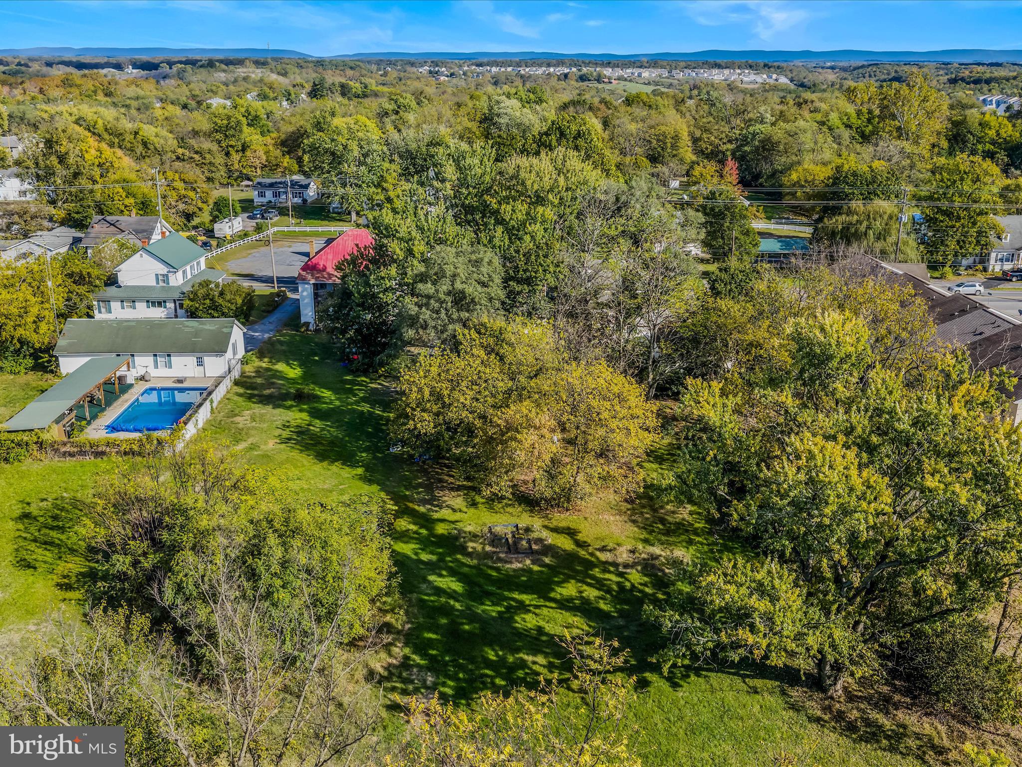 9872 Winchester Avenue Bunker Hill, WV 25413 - Photo 38 of 46 a aerial view of a houses with a yard