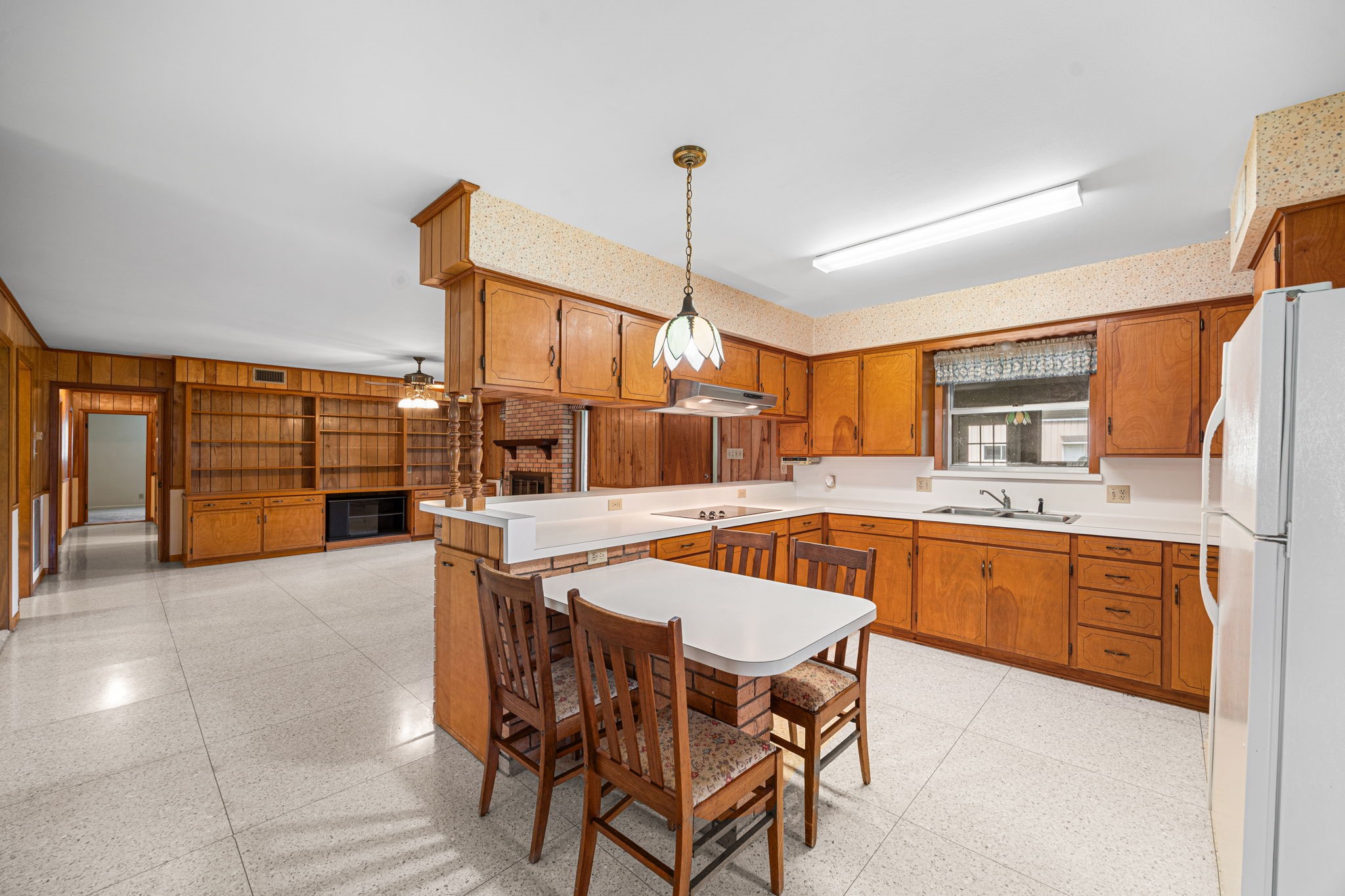 613 Baker Road Rosenberg, TX 77471 - Photo 11 of 28 a kitchen with stainless steel appliances granite countertop a kitchen island a stove a table and chairs in it