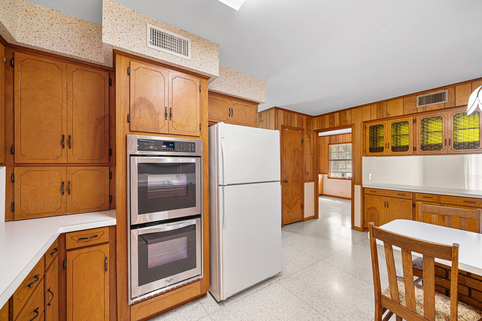 613 Baker Road Rosenberg, TX 77471 - Photo 12 of 28 a kitchen with stainless steel appliances a refrigerator and a stove top oven
