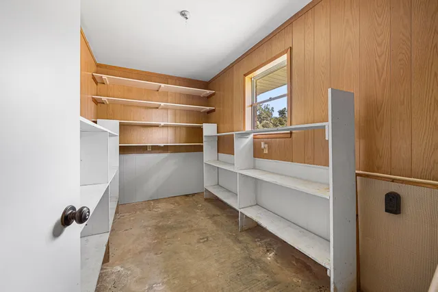 a house with green field in front of it