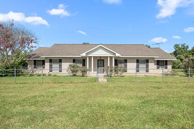 a front view of a house with yard
