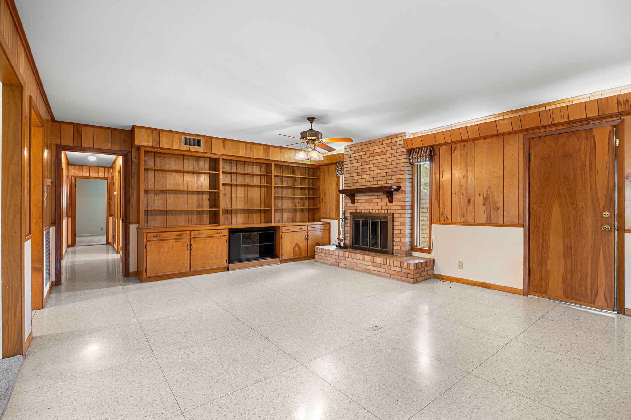 613 Baker Road Rosenberg, TX 77471 - Photo 9 of 28 a view of an empty room with a fireplace and cabinet