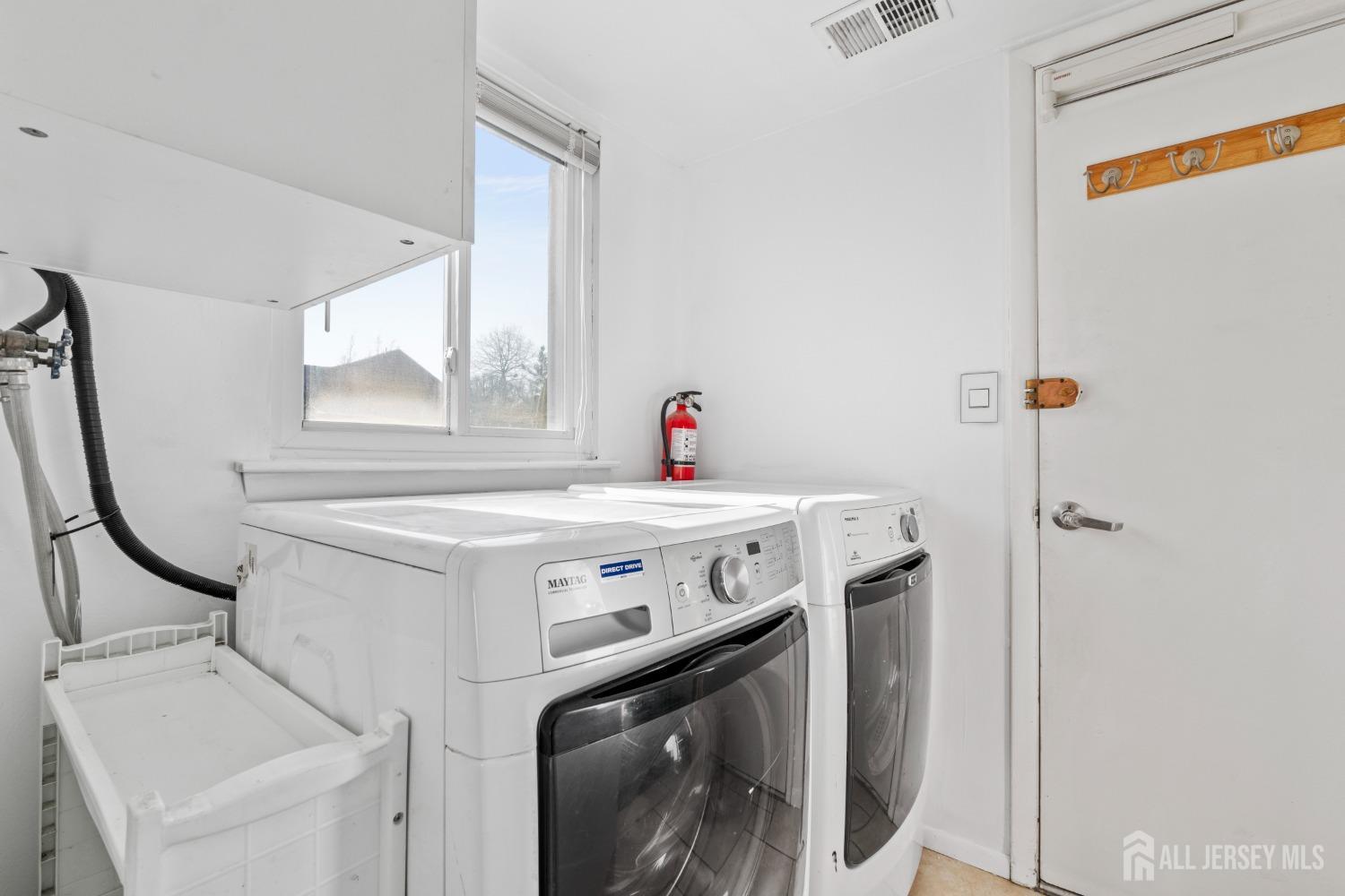 171 Westgate Drive Edison, NJ 08820 - Photo 24 of 49 a utility room with dryer and washer