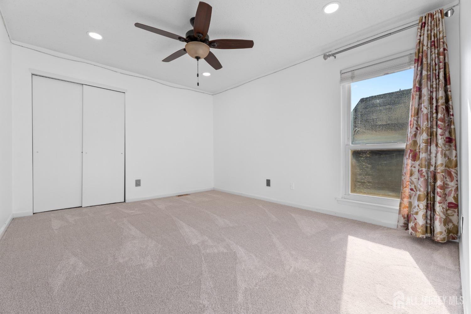 171 Westgate Drive Edison, NJ 08820 - Photo 27 of 49 a view of an empty room with a fireplace