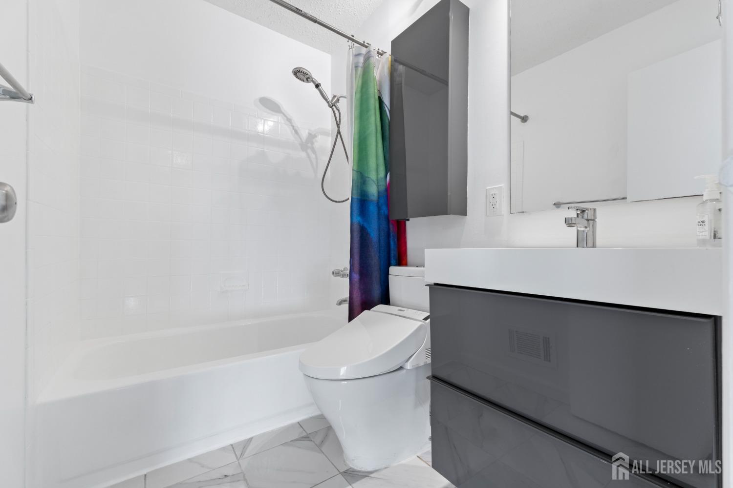 171 Westgate Drive Edison, NJ 08820 - Photo 29 of 49 a bathroom with a sink a toilet and shower