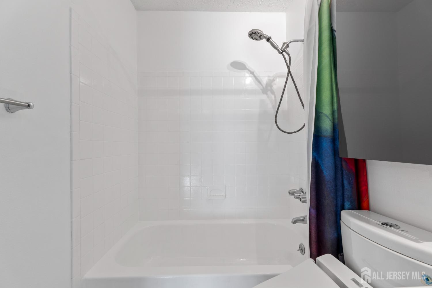 171 Westgate Drive Edison, NJ 08820 - Photo 30 of 49 a bathroom with a shower and a toilet