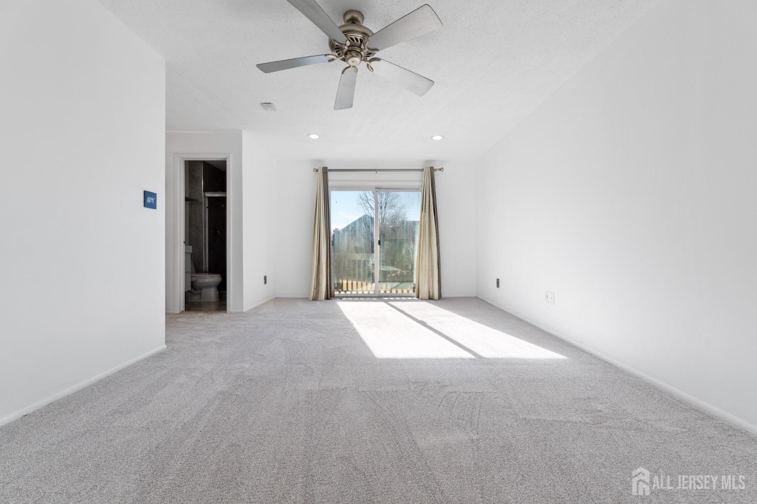 171 Westgate Drive Edison, NJ 08820 - Photo 32 of 49 an empty room with windows and fan