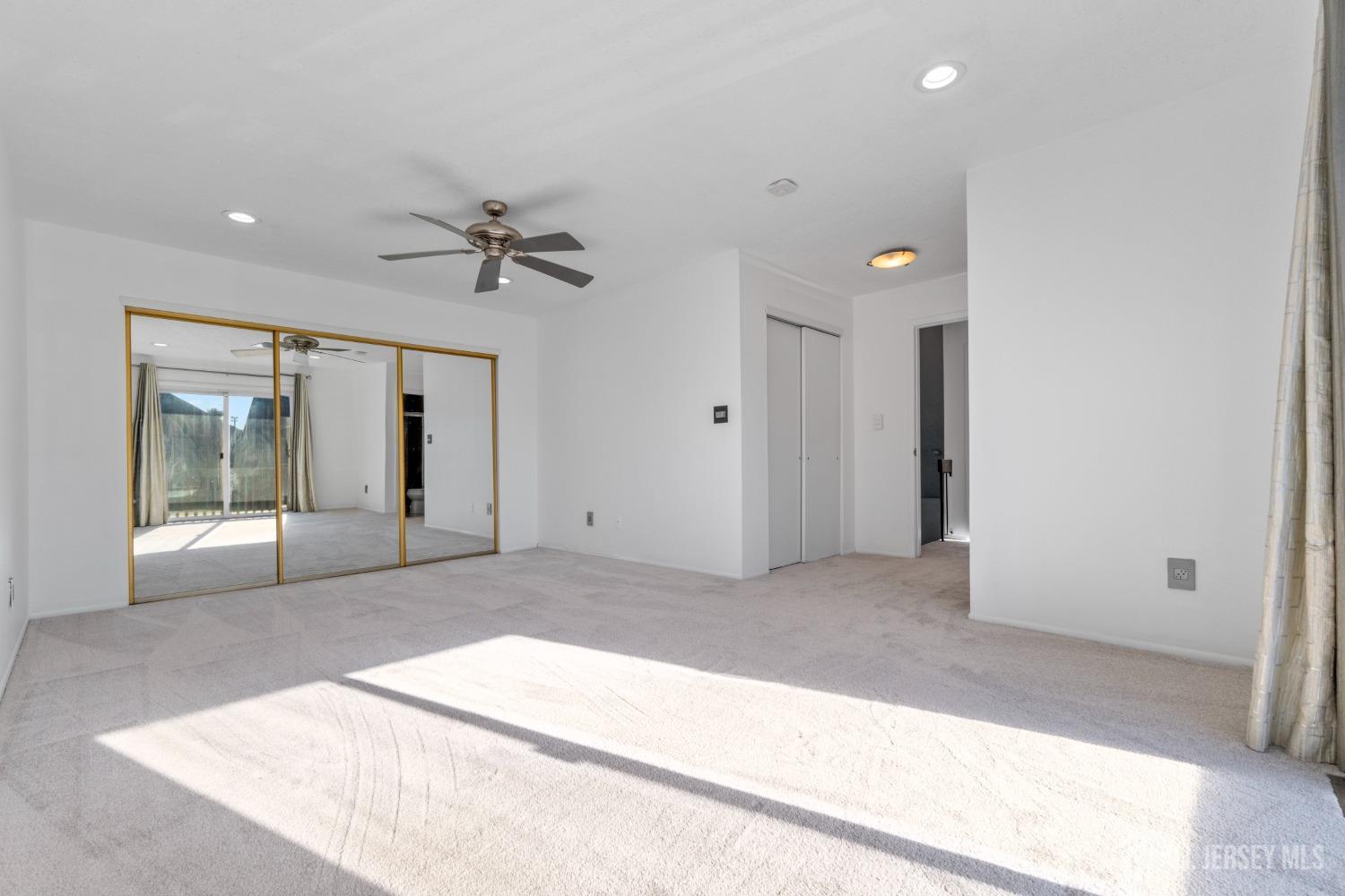 171 Westgate Drive Edison, NJ 08820 - Photo 33 of 49 a view of a livingroom with a ceiling fan and entryway