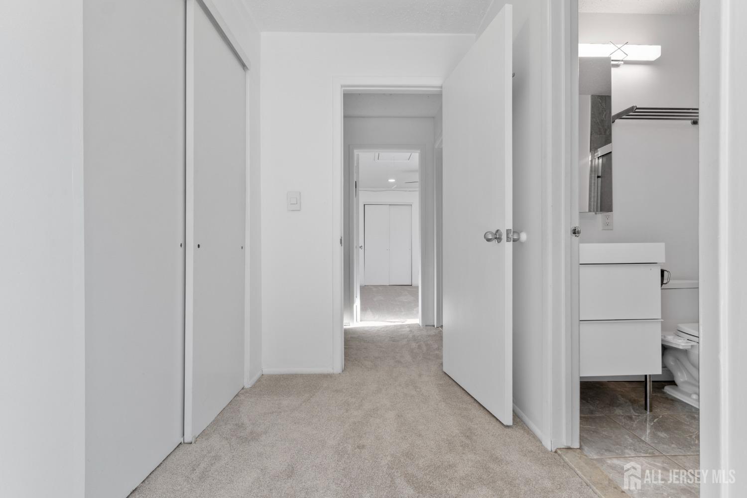 171 Westgate Drive Edison, NJ 08820 - Photo 34 of 49 a view of a hallway with two rooms