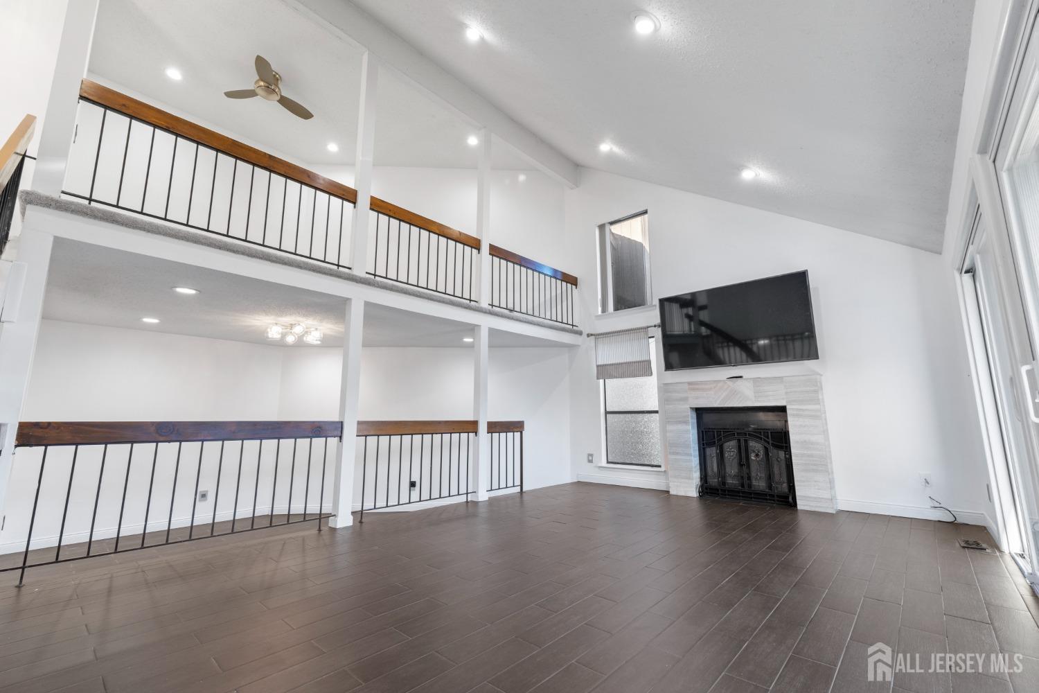 171 Westgate Drive Edison, NJ 08820 - Photo 9 of 49 a view of livingroom with furniture flat screen tv and outdoor view