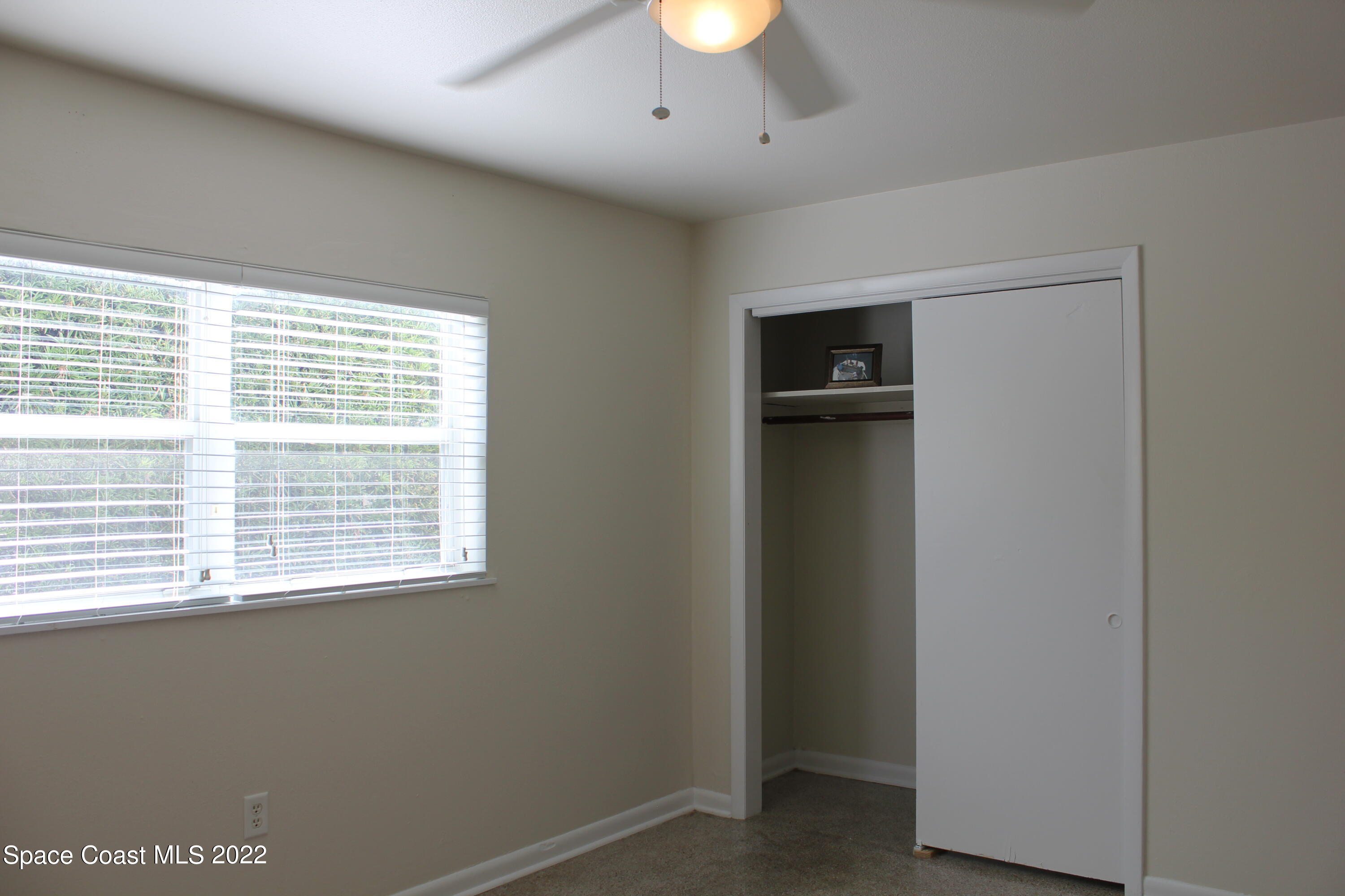 651 Palm Drive, Unit C2 Satellite Beach, FL 32937 - Photo 4 of 13 a view of an empty room with a window