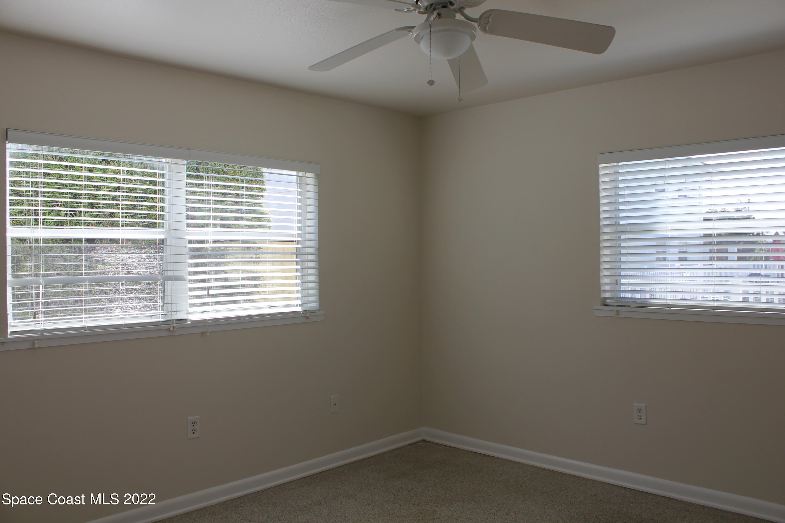 651 Palm Drive, Unit C2 Satellite Beach, FL 32937 - Photo 8 of 13 an empty room with a window
