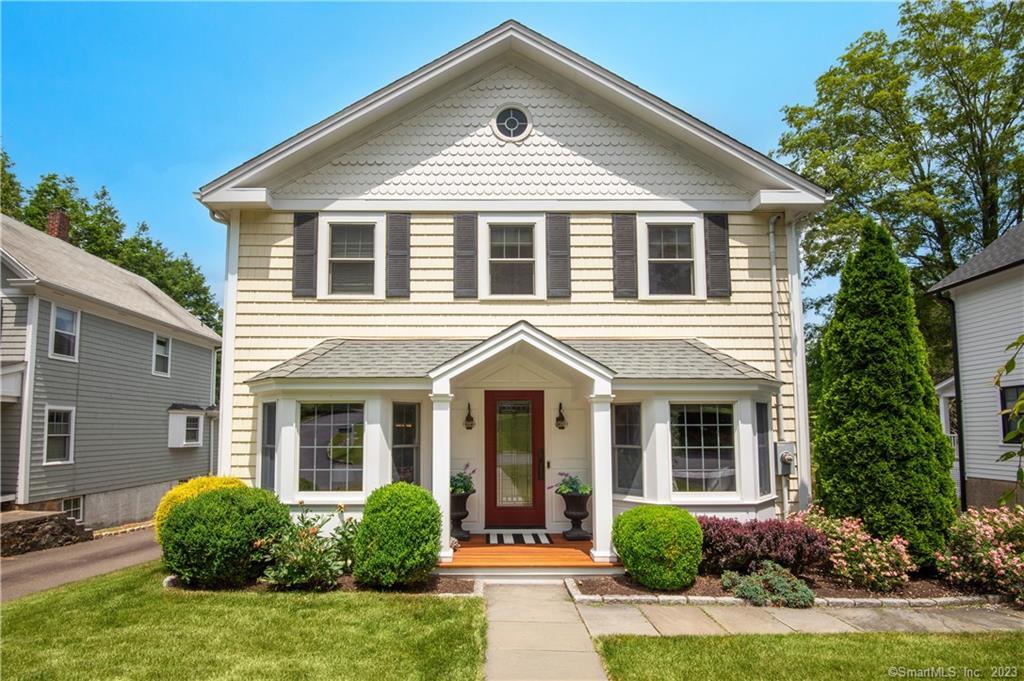 front view of a house with a yard