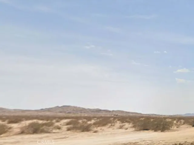 a view of mountain with sky