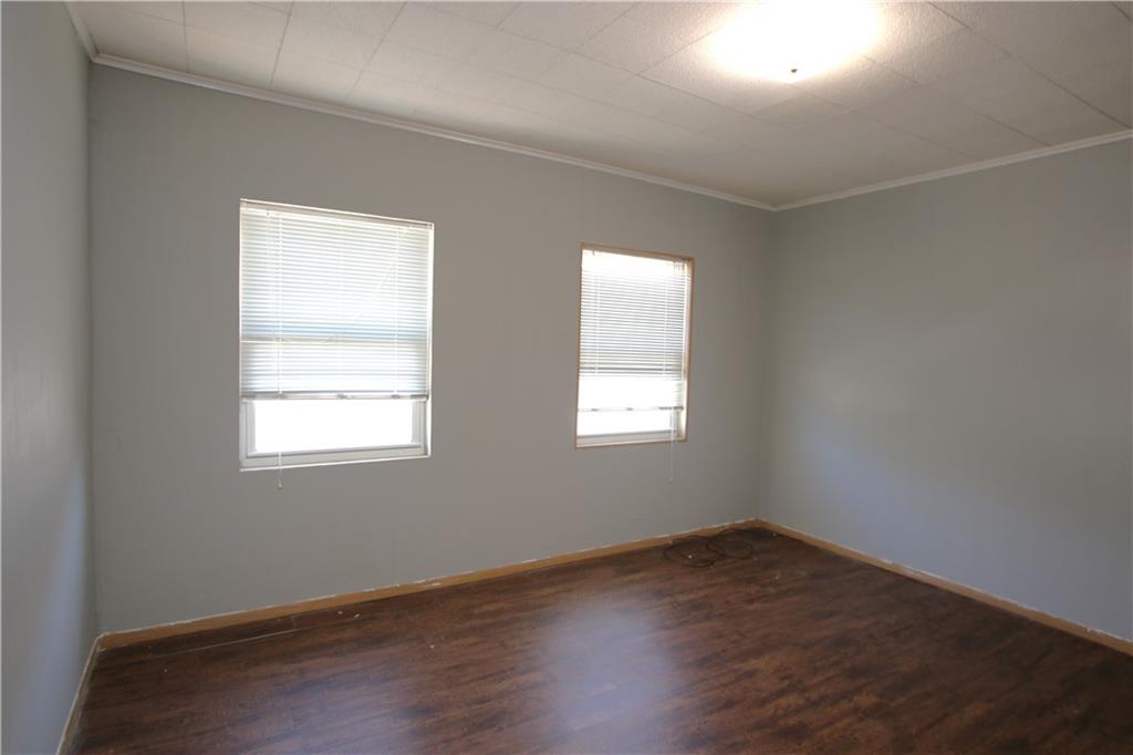 102 10th Street Monongahela, PA 15063 - Photo 15 of 31 an empty room with wooden floor and windows