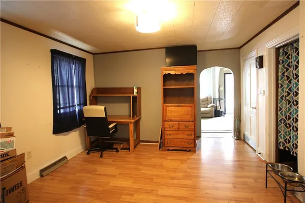 a view of a livingroom with furniture and a workspace