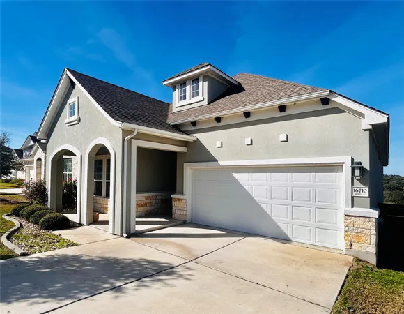a front view of a house with parking area