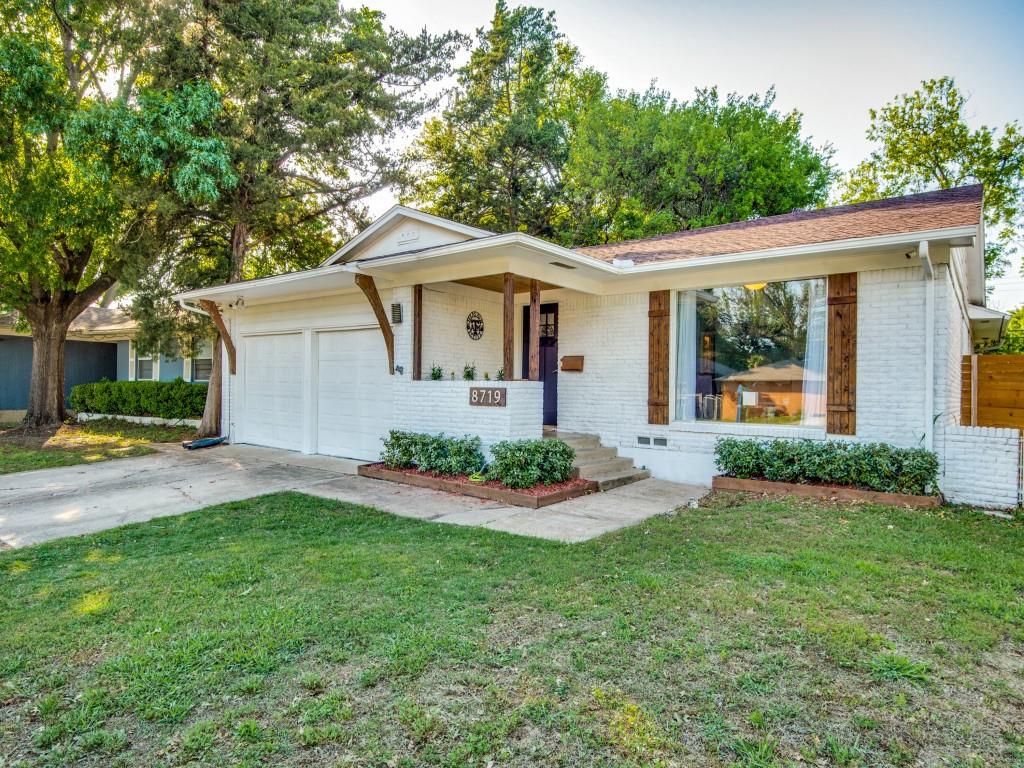 8719 Westfield Drive Dallas, TX 75243 - Photo 1 of 1 a front view of house with yard and green space