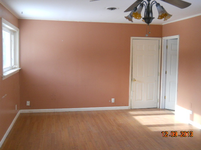 6 Butterfield Road Lake Zurich, IL 60047 - Photo 5 of 11 an empty room with wooden floor and windows