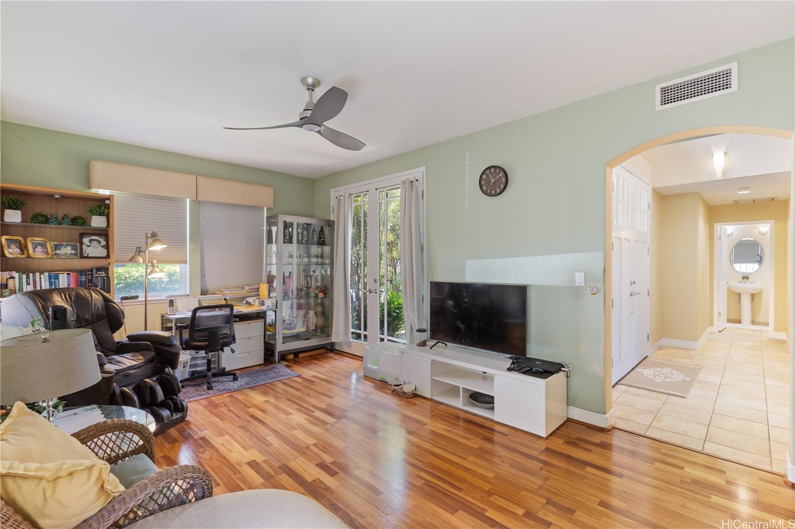 92-1015 Koio Drive, Unit S52 Kapolei, HI 96707 - Photo 15 of 18 a living room with furniture and a flat screen tv
