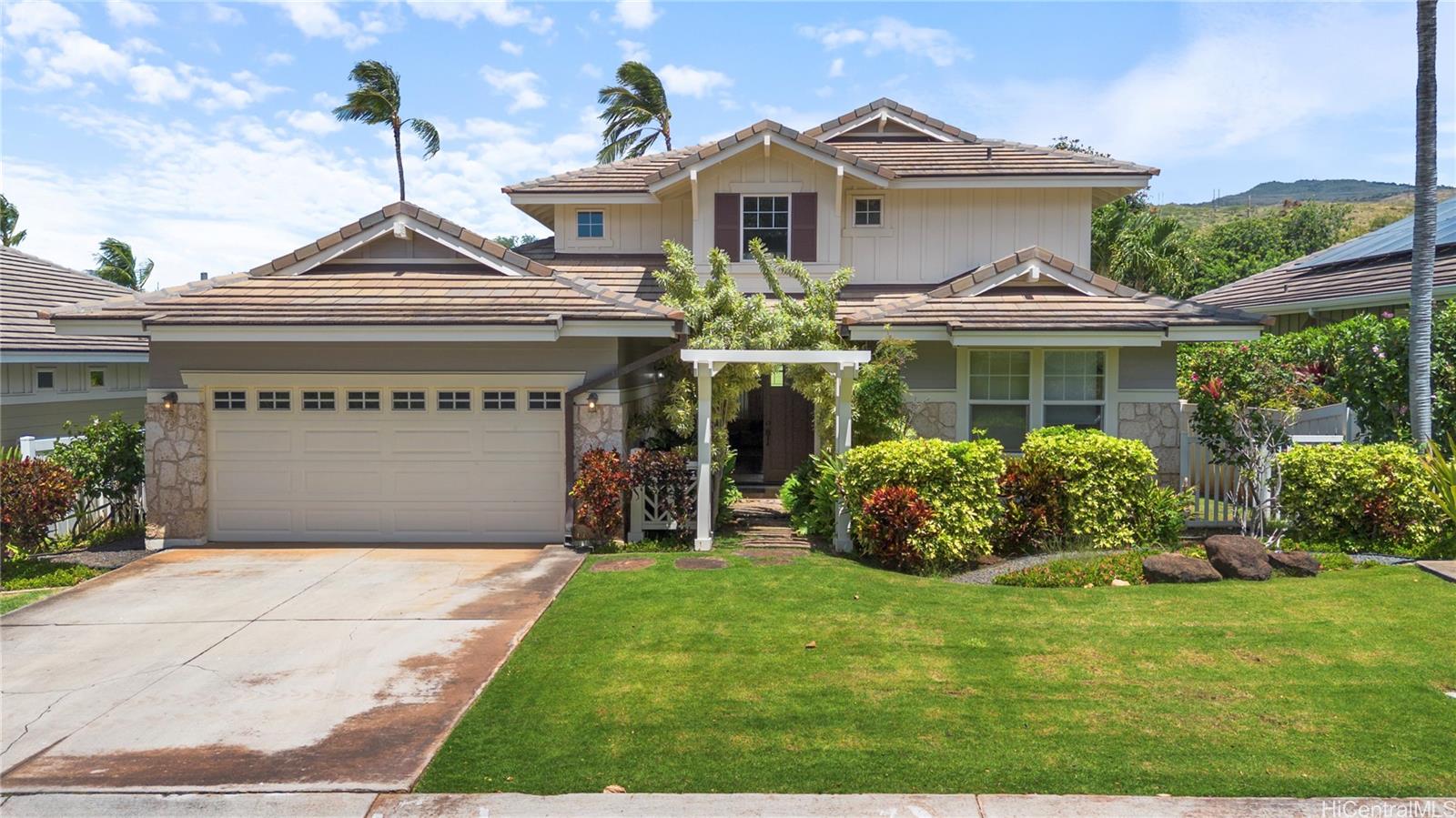 92-1015 Koio Drive, Unit S52 Kapolei, HI 96707 - Photo 2 of 18 a front view of a house with garden