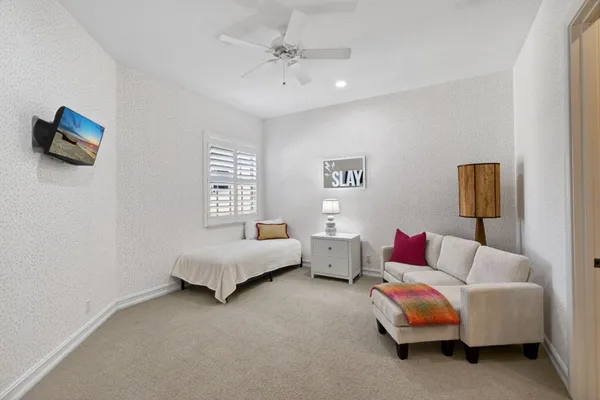 a bed room with furniture and a window