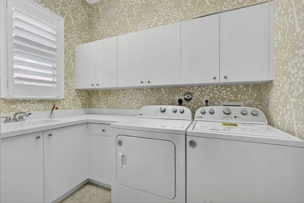 a view of living room with a floor to ceiling window and wooden floor
