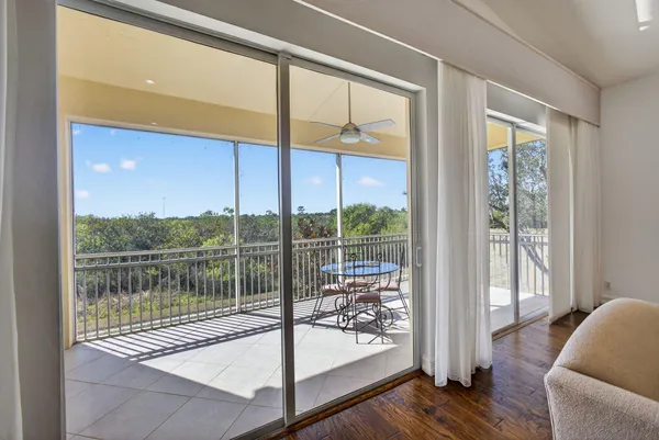 a view of a balcony with chairs