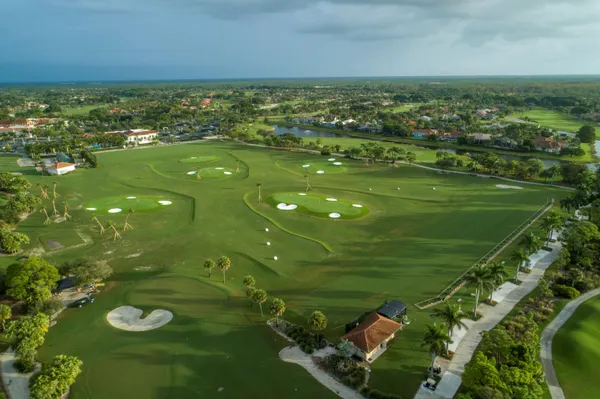 an aerial view of a houses with a yard
