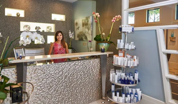 a view of a tables and chairs under an umbrella