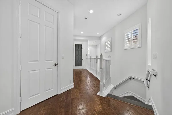 a view of entryway with wooden floor