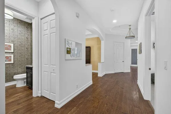 a view of a bathroom with a hardwood floor and a sink