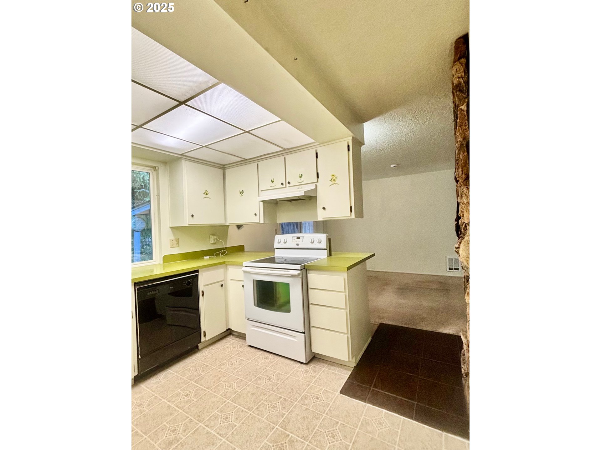 3314 Munsel Lake Road Florence, OR 97439 - Photo 11 of 29 a kitchen with a sink cabinets and stainless steel appliances
