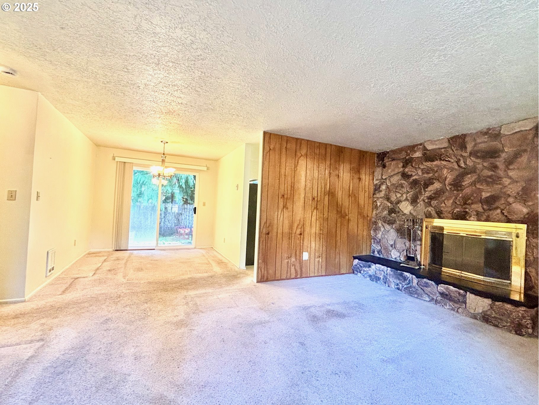 3314 Munsel Lake Road Florence, OR 97439 - Photo 14 of 29 a view of an empty room with a fireplace and a window