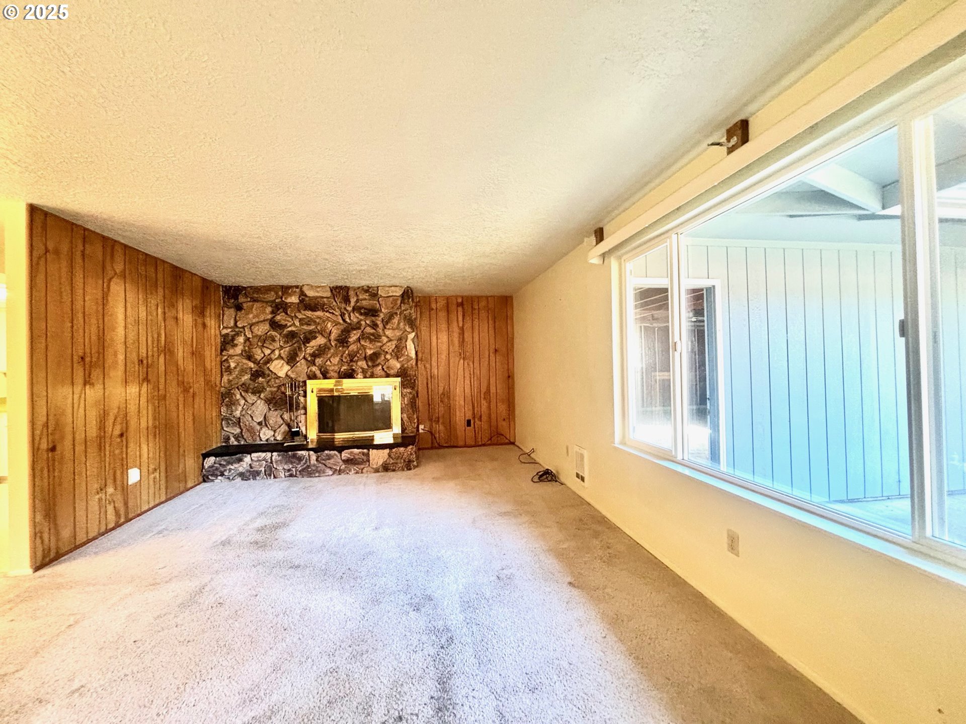 3314 Munsel Lake Road Florence, OR 97439 - Photo 15 of 29 a view of an empty room with a fireplace