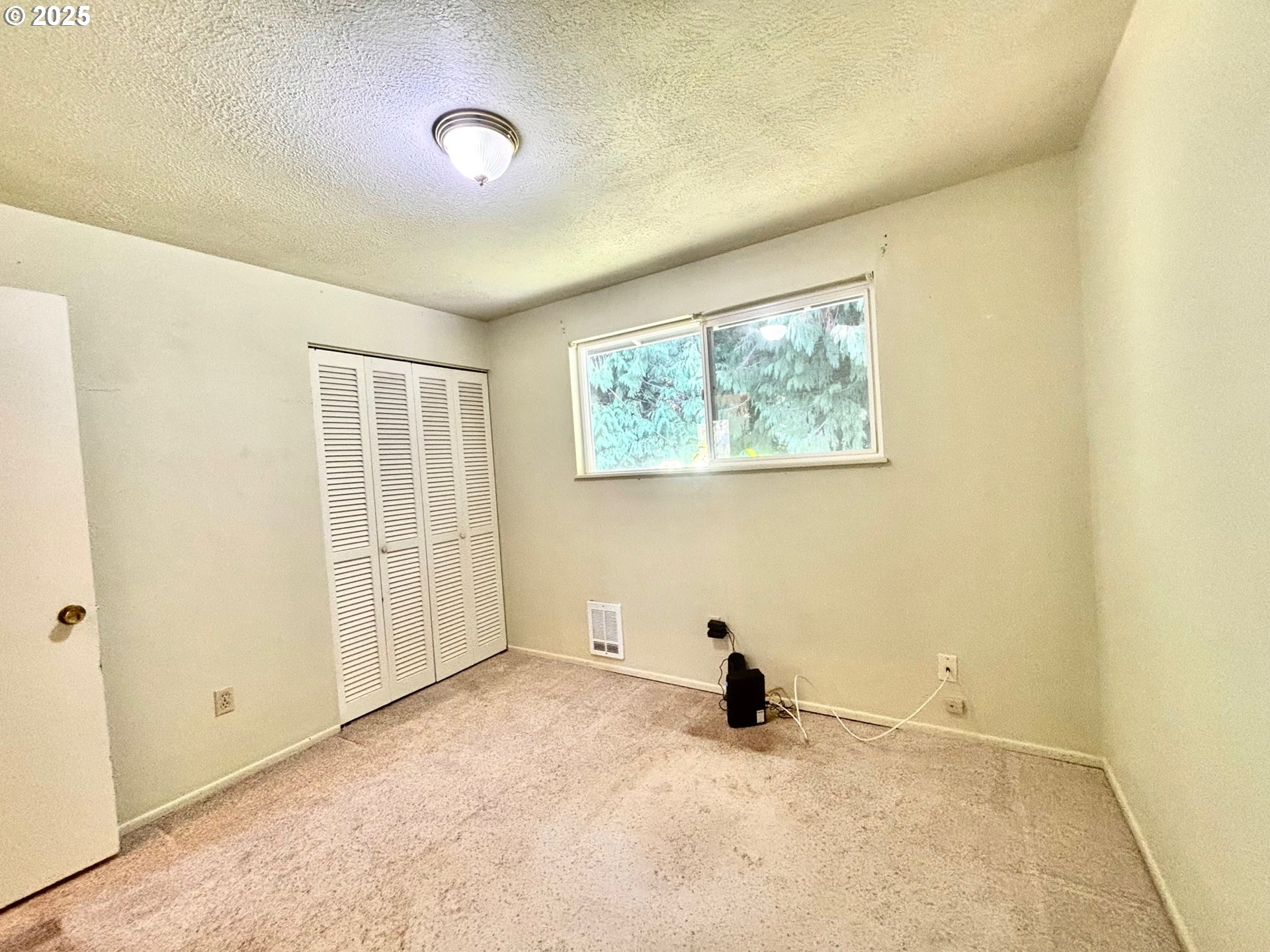3314 Munsel Lake Road Florence, OR 97439 - Photo 16 of 29 a view of an empty room with a window